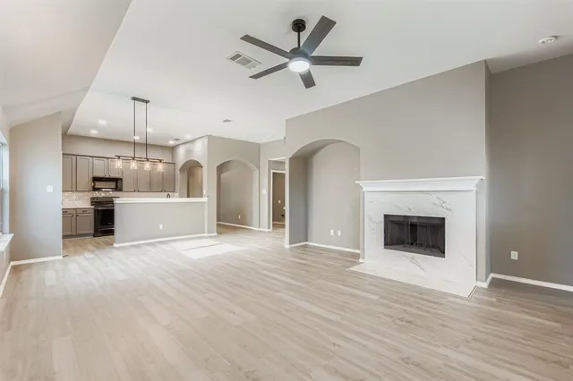 a view of a kitchen with a sink and a stove top oven