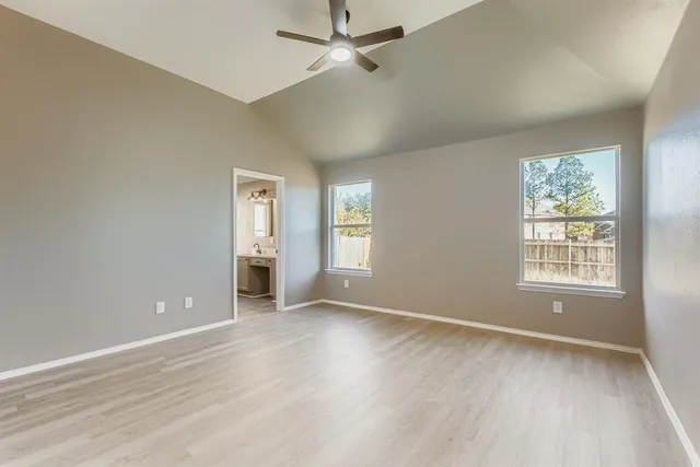 a view of a kitchen with a sink and a window