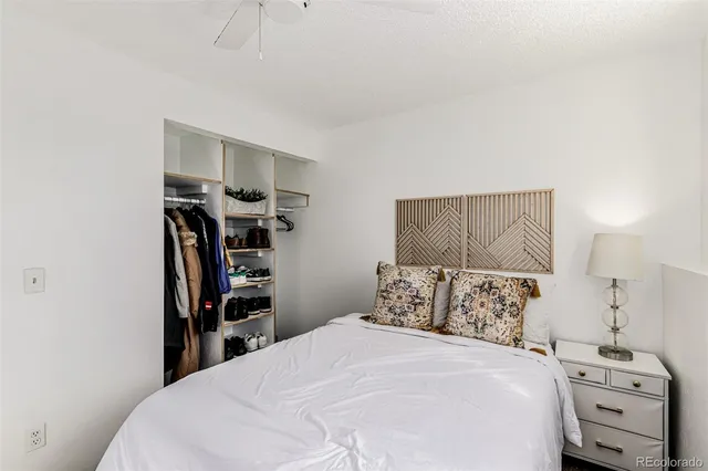 a bedroom with a bed and a tv