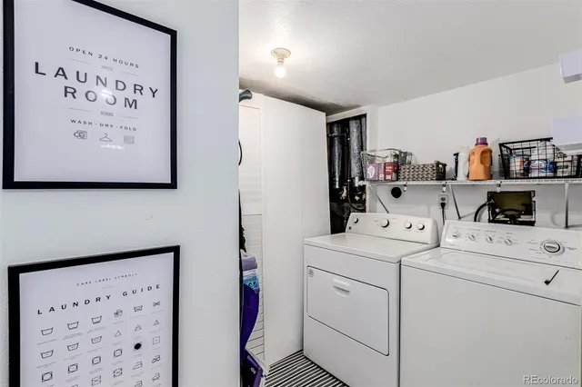 a view of storage and utility room with washer and dryer