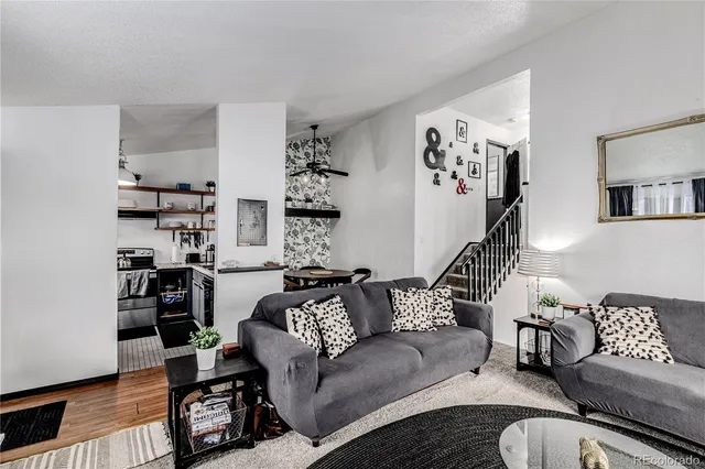 a living room with furniture window and a lamp