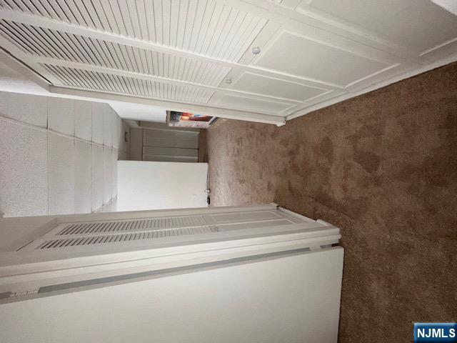 77 Prospect Avenue, Unit 1A Hackensack, NJ 07601 - Photo 12 of 16 a view of a room with door