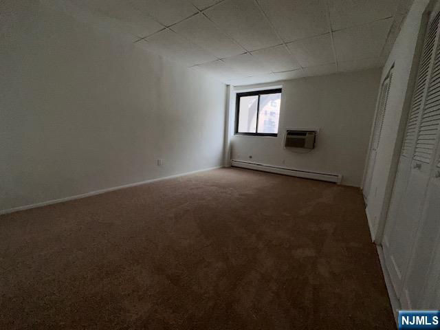 77 Prospect Avenue, Unit 1A Hackensack, NJ 07601 - Photo 10 of 16 an empty room with windows