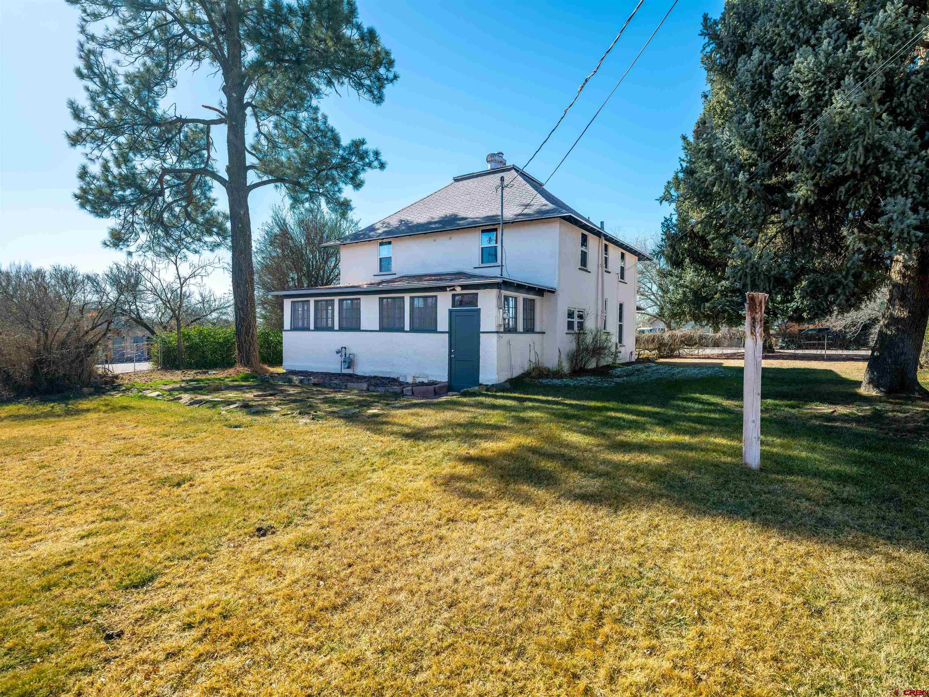144 South Market Street Cortez, CO 81321 - Photo 25 of 41 a view of a house with a yard