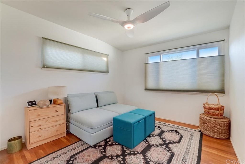 13040 Delano Street Van Nuys, CA 91401 - Photo 25 of 64 a living room with furniture and a flat screen tv
