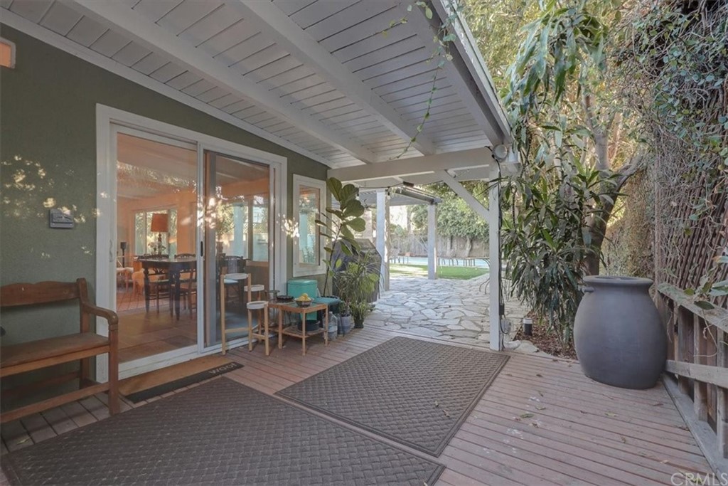 13040 Delano Street Van Nuys, CA 91401 - Photo 37 of 64 a view of a patio with table and chairs and potted plants