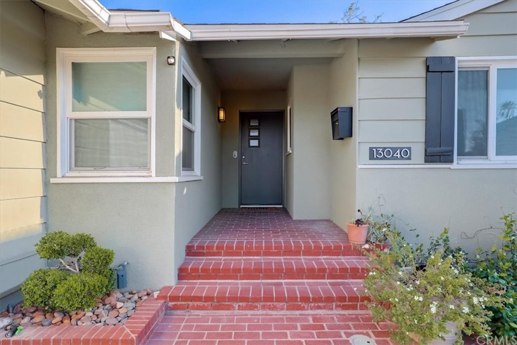 13040 Delano Street Van Nuys, CA 91401 - Photo 4 of 64 a front view of a house