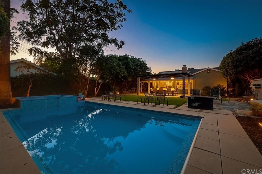 13040 Delano Street Van Nuys, CA 91401 - Photo 49 of 64 a view of a swimming pool with a patio