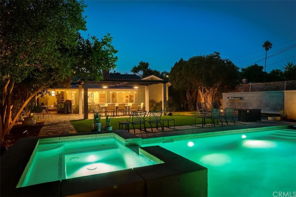 13040 Delano Street Van Nuys, CA 91401 - Photo 55 of 64 a view of yard with swimming pool and green space
