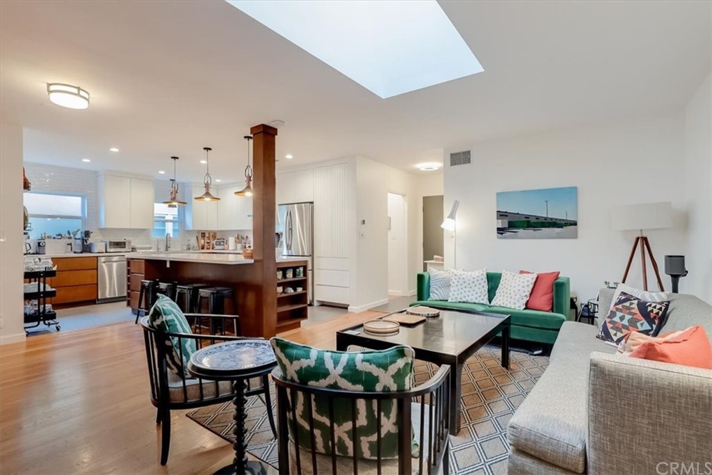 13040 Delano Street Van Nuys, CA 91401 - Photo 7 of 64 a dining room with furniture and wooden floor
