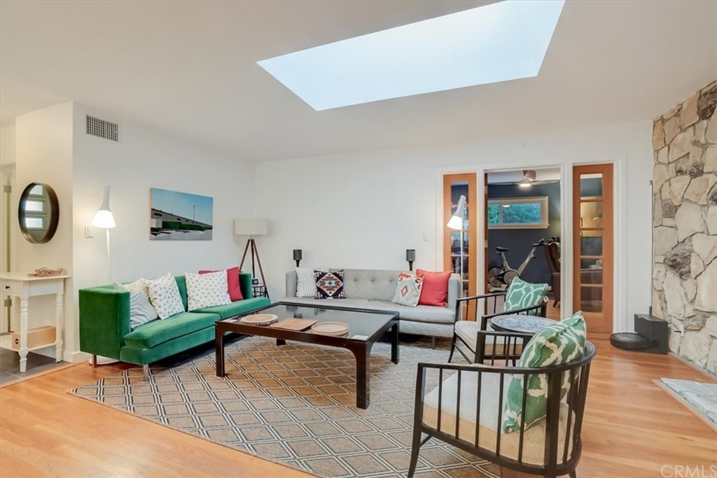 13040 Delano Street Van Nuys, CA 91401 - Photo 8 of 64 a living room with furniture and a flat screen tv