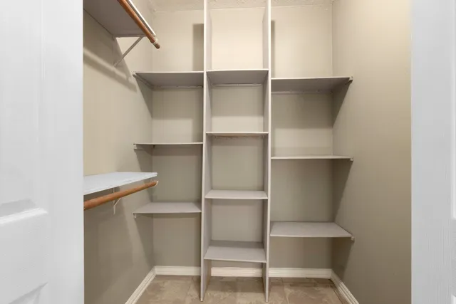 a view of an empty walk in closet