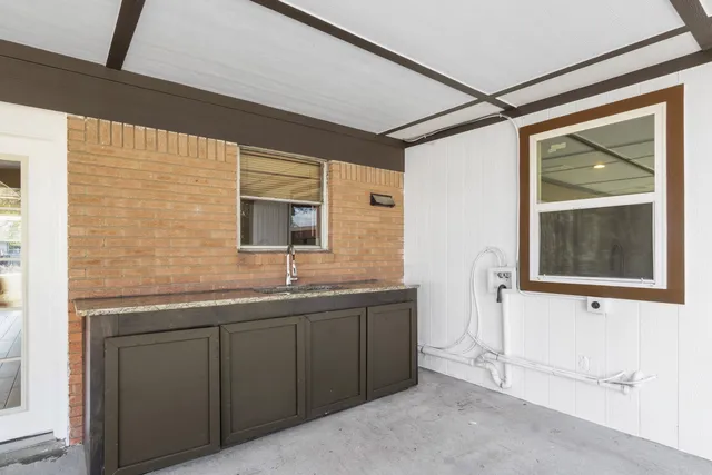 a bathroom with a double vanity sink and mirror