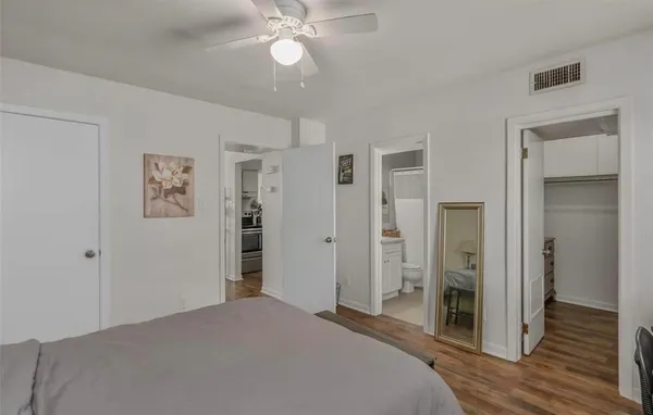 a bedroom with a bed and a view of bathroom