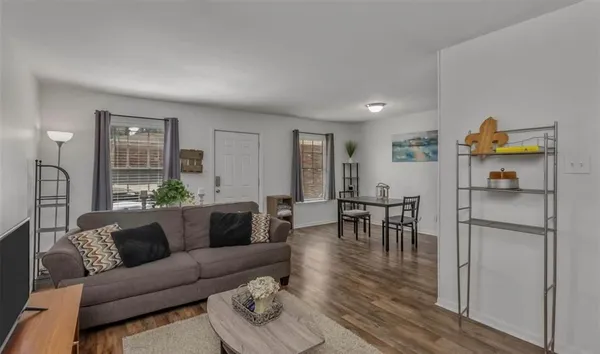a living room with furniture and a table