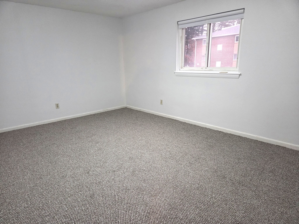 586 Boston Post Road East, Unit 6 Marlborough, MA 01752 - Photo 12 of 17 an empty room with a window
