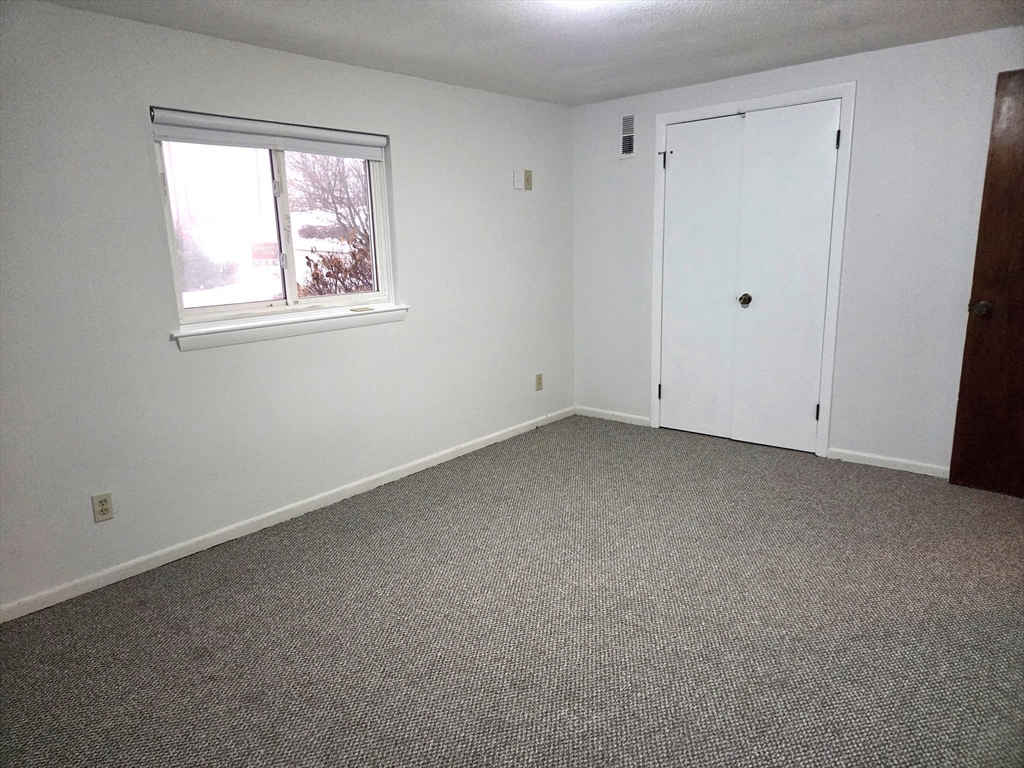 586 Boston Post Road East, Unit 6 Marlborough, MA 01752 - Photo 13 of 17 a view of room with window