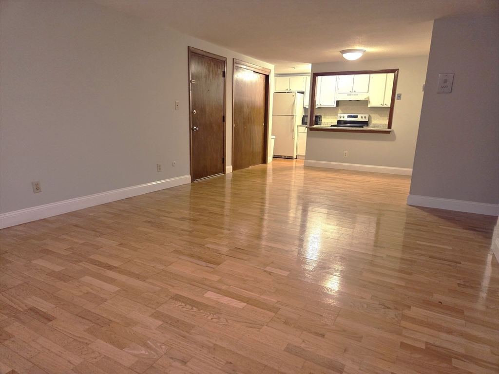 586 Boston Post Road East, Unit 6 Marlborough, MA 01752 - Photo 14 of 17 a view of a hallway with wooden floor