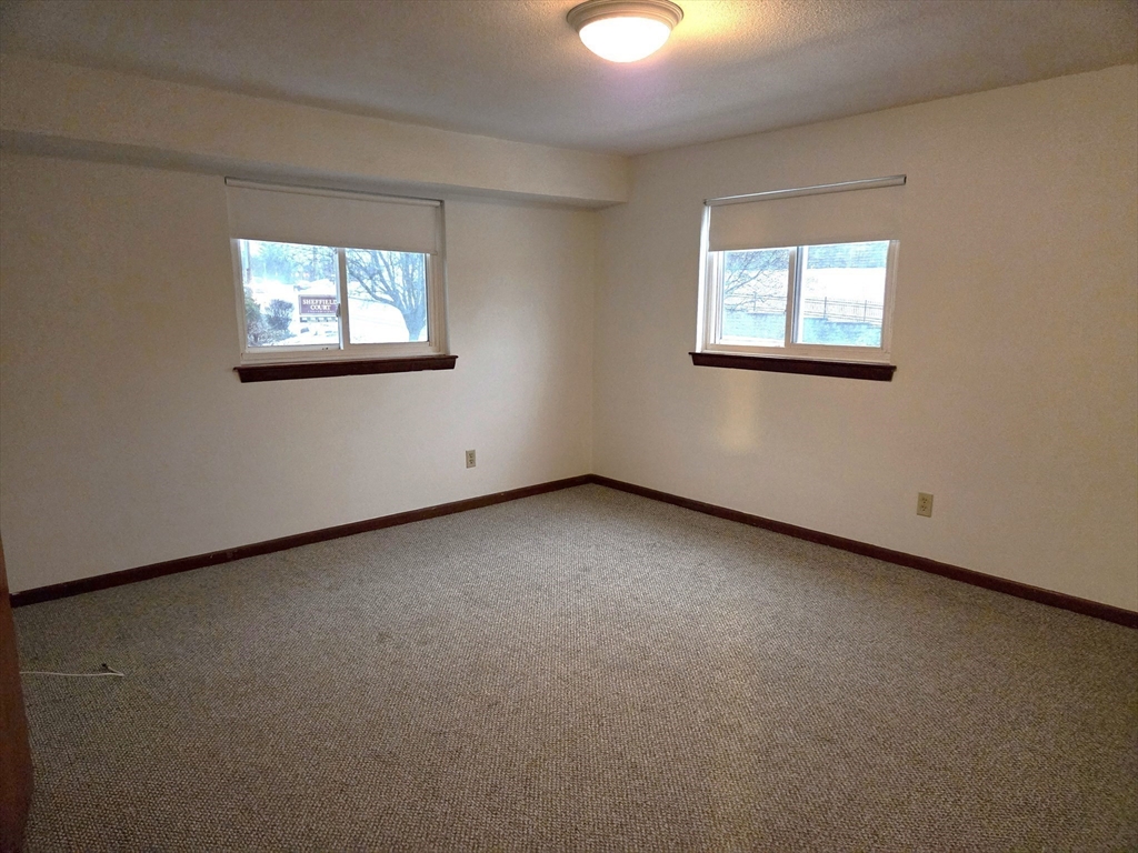 586 Boston Post Road East, Unit 6 Marlborough, MA 01752 - Photo 9 of 17 an empty room with windows