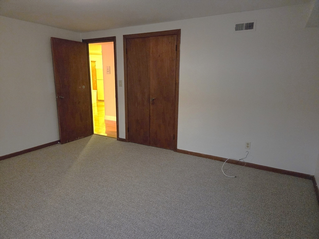 586 Boston Post Road East, Unit 6 Marlborough, MA 01752 - Photo 10 of 17 a view of empty room with window