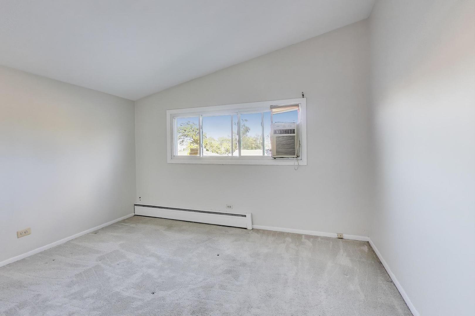 9454 Potter Road Des Plaines, IL 60016 - Photo 14 of 33 an empty room with a window