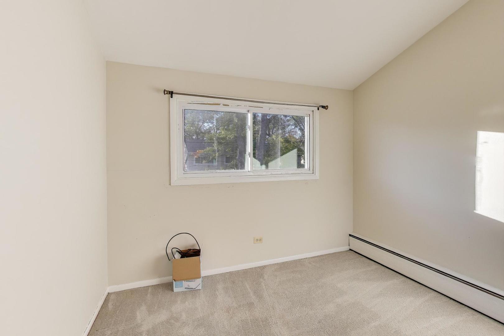 9454 Potter Road Des Plaines, IL 60016 - Photo 19 of 33 a room with a window