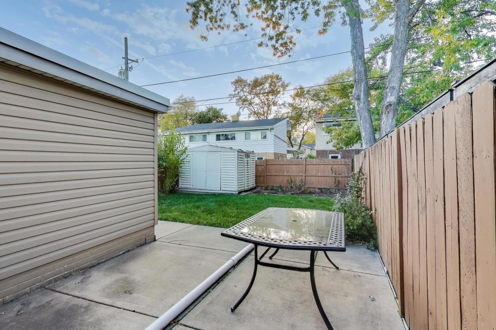 9454 Potter Road Des Plaines, IL 60016 - Photo 27 of 33 a view of a backyard with a garden and plants