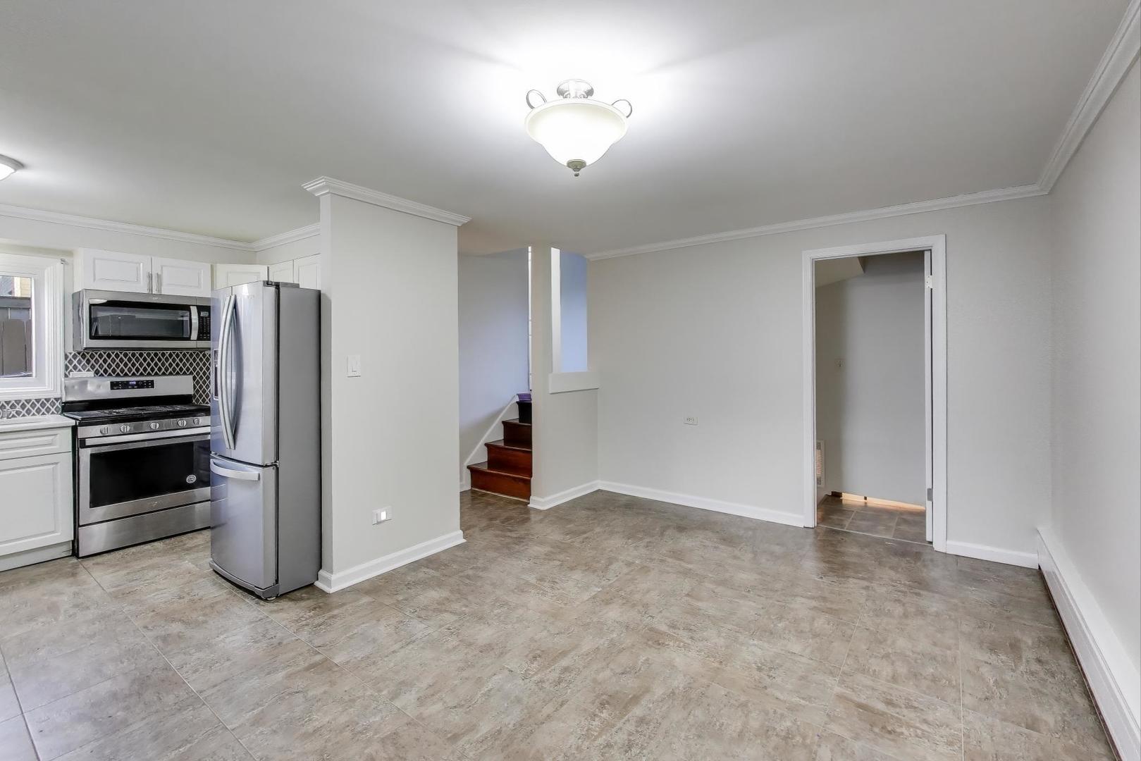 9454 Potter Road Des Plaines, IL 60016 - Photo 8 of 33 a view of a kitchen with a stove cabinets and a kitchen