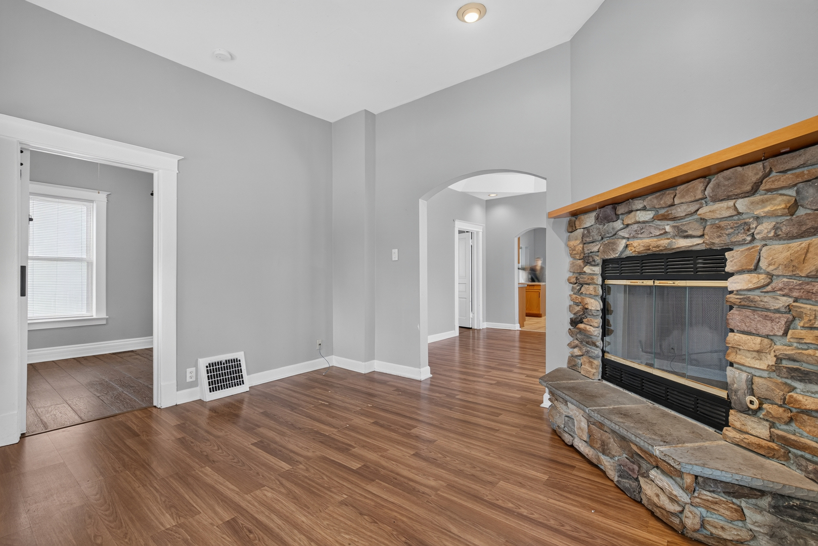 1128 Butler Street Morris, IL 60450 - Photo 7 of 28 a view of empty room with wooden floor and fireplace