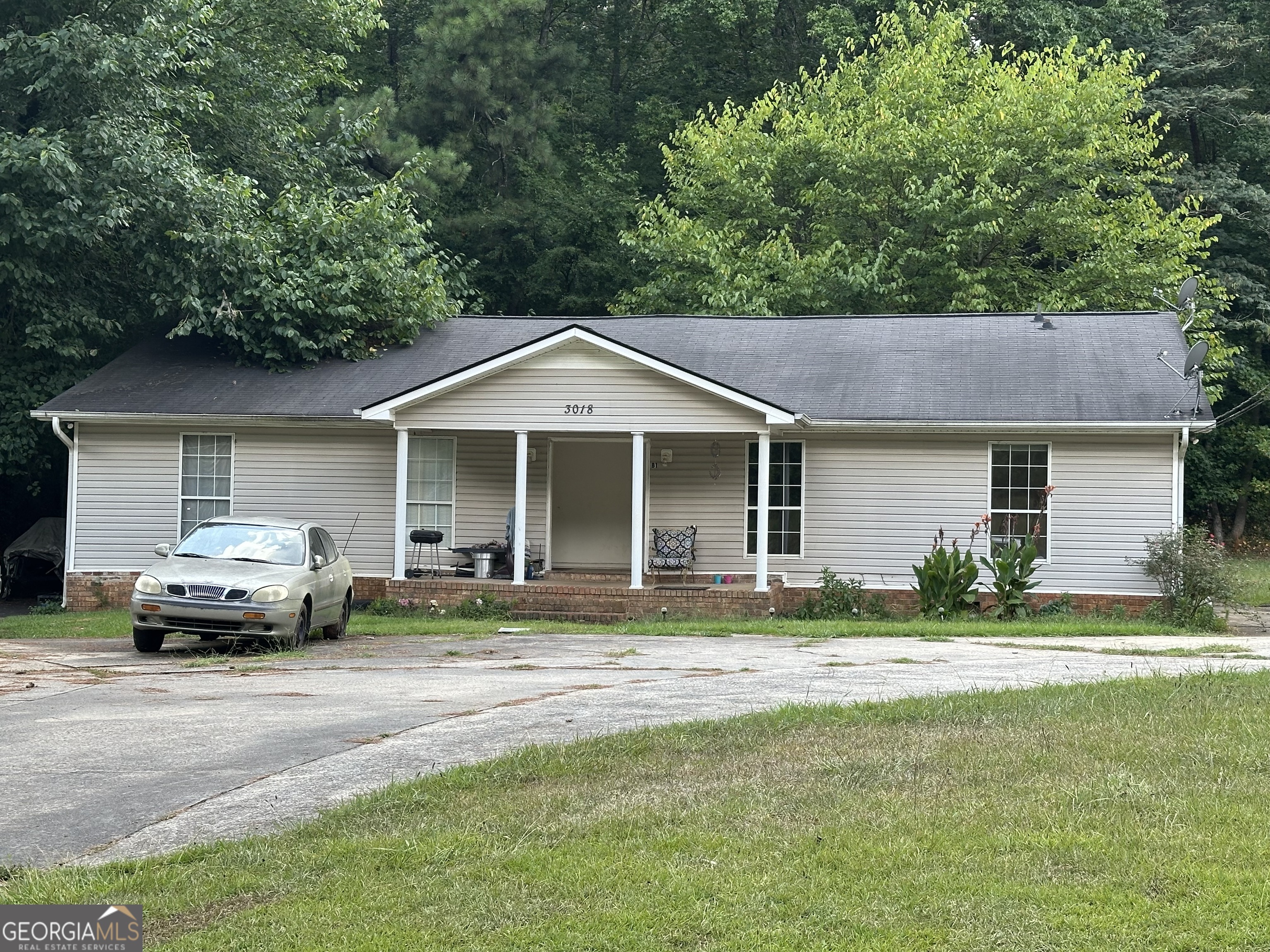 3018 Callier Springs Road Southeast Rome, GA 30161 - Photo 1 of 1 a house view with a seating space and garden space