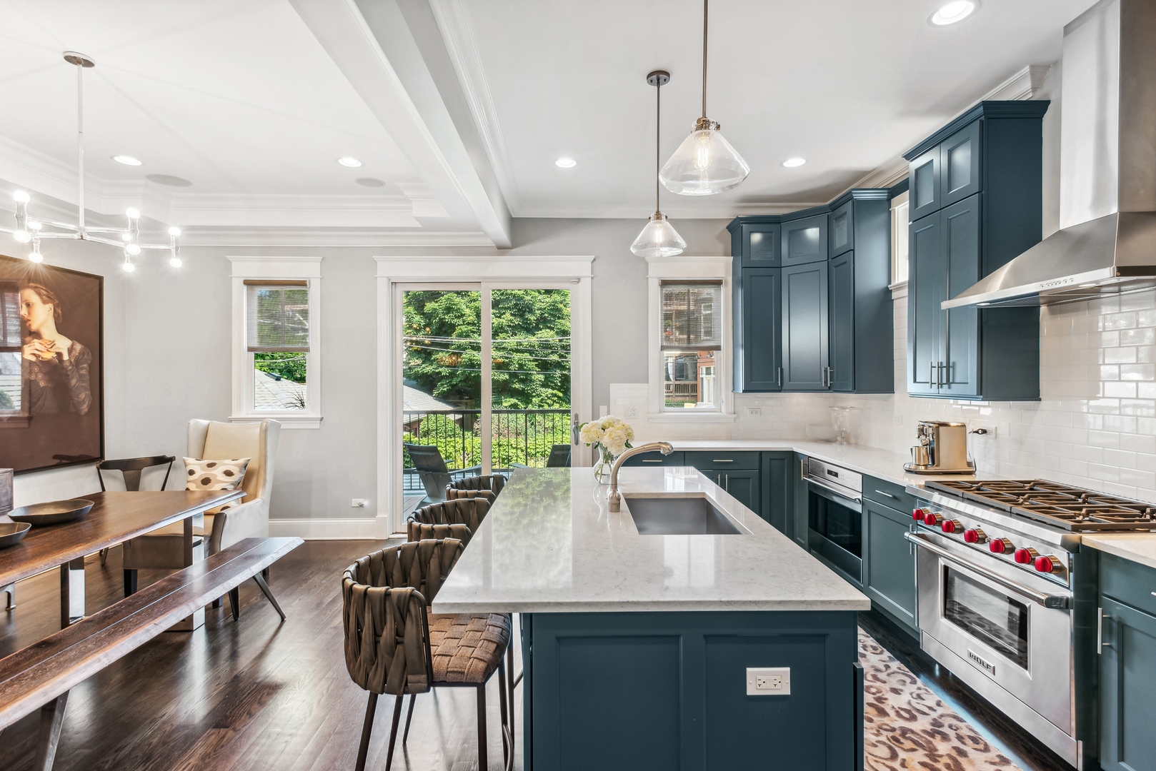 2413 North Orchard Street Chicago, IL 60614 - Photo 13 of 33 a kitchen that has a sink a stove and a table with chairs