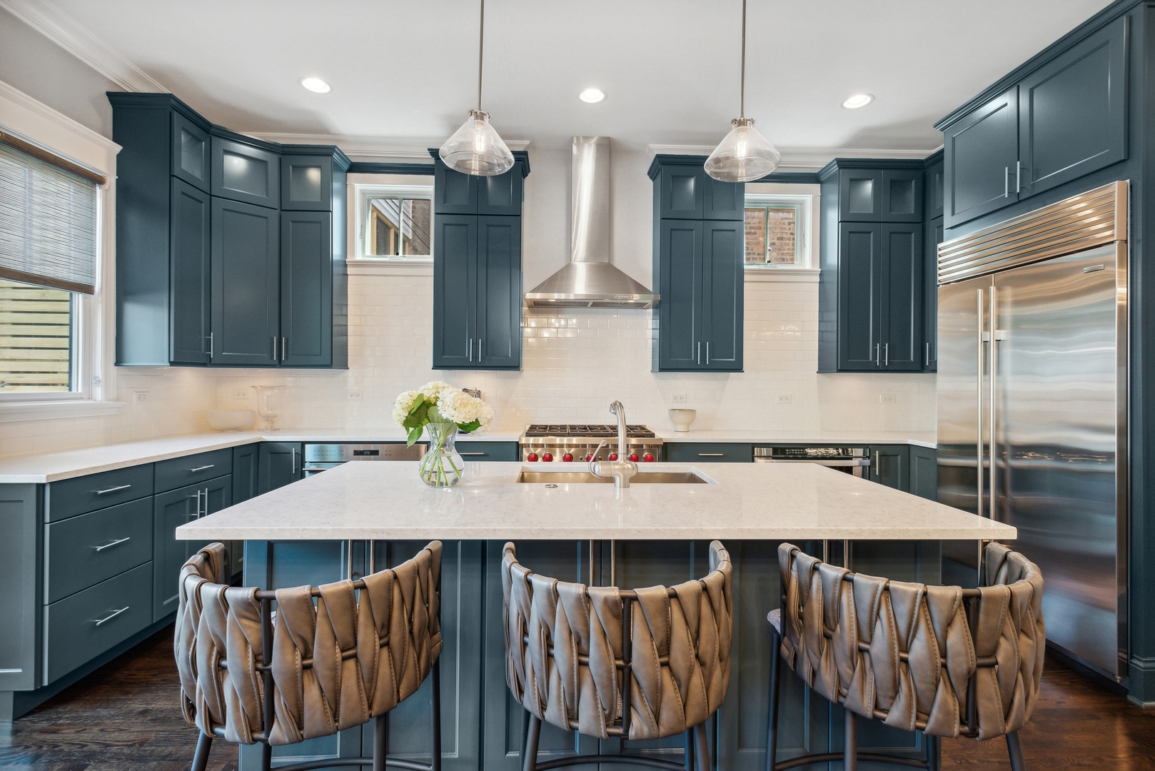 2413 North Orchard Street Chicago, IL 60614 - Photo 14 of 33 a kitchen with a dining table chairs stainless steel appliances and cabinets