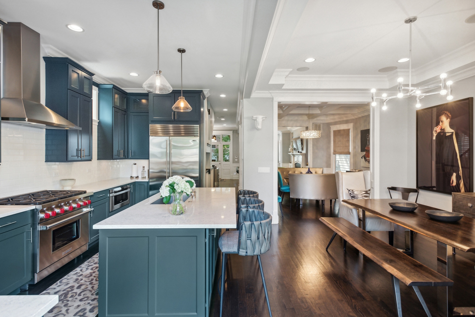 2413 North Orchard Street Chicago, IL 60614 - Photo 16 of 33 a kitchen with stainless steel appliances kitchen island granite countertop a stove a sink a refrigerator and a dining table with wooden floor