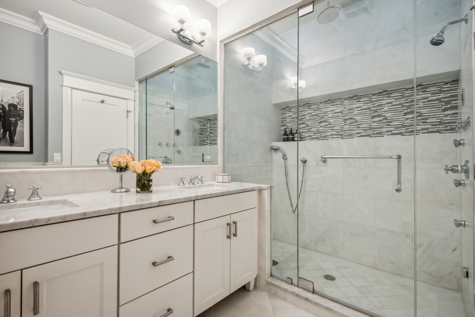 2413 North Orchard Street Chicago, IL 60614 - Photo 26 of 33 a bathroom with a shower sink and mirror