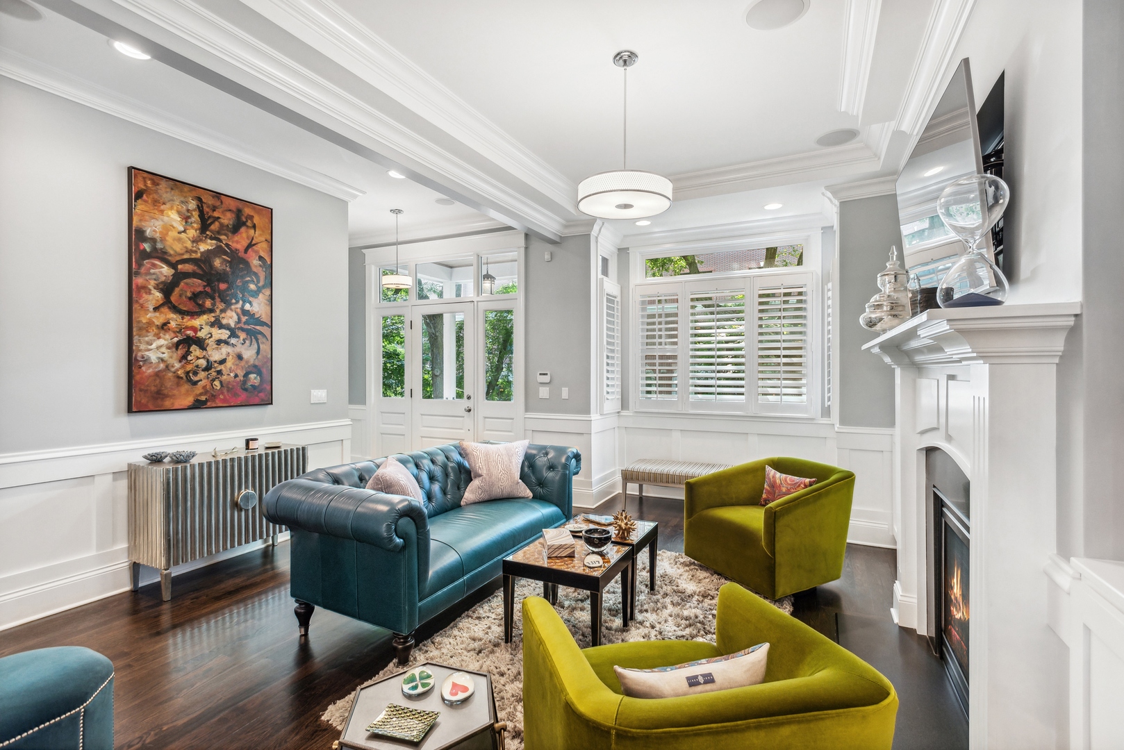 2413 North Orchard Street Chicago, IL 60614 - Photo 4 of 33 a living room with furniture a fireplace and a chandelier