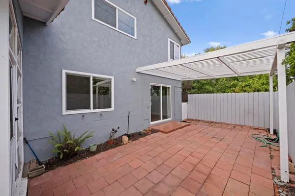 a house view with a backyard space
