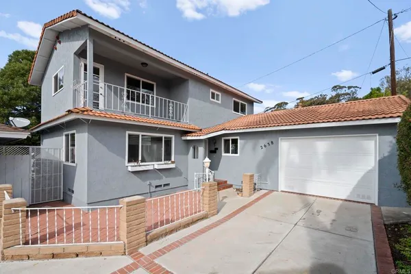 a front view of a house with a garage