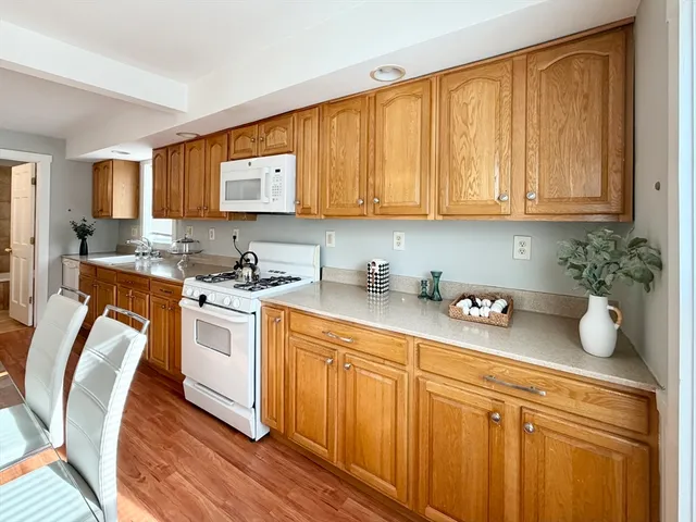 a bedroom with a bed and a potted plant