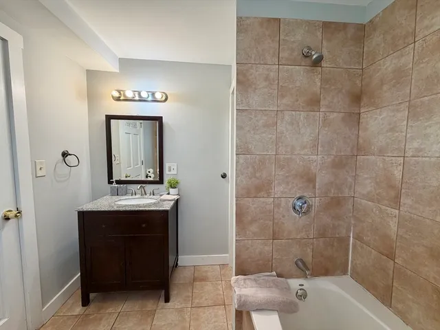a bathroom with a bathtub and toilet