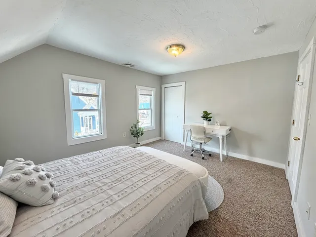 a view of a room with wooden walls