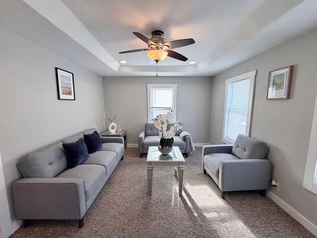 a living room with furniture and window