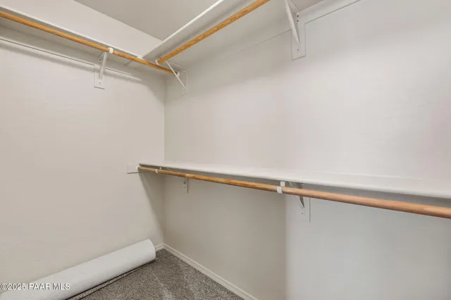 a view of a room with shelf on the wall