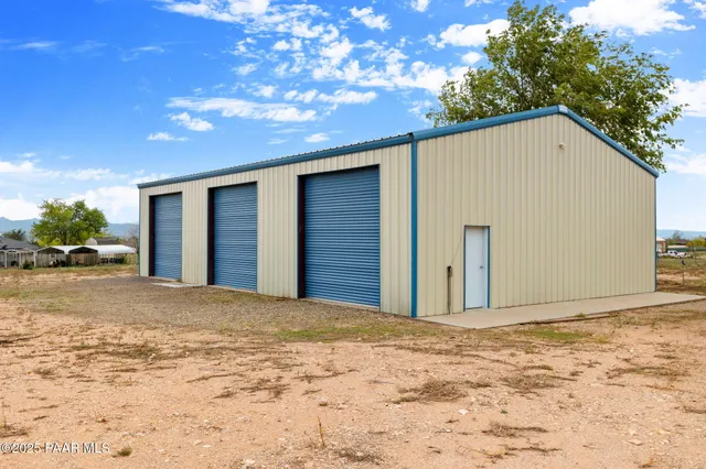 a view of empty room with wooden ceiling