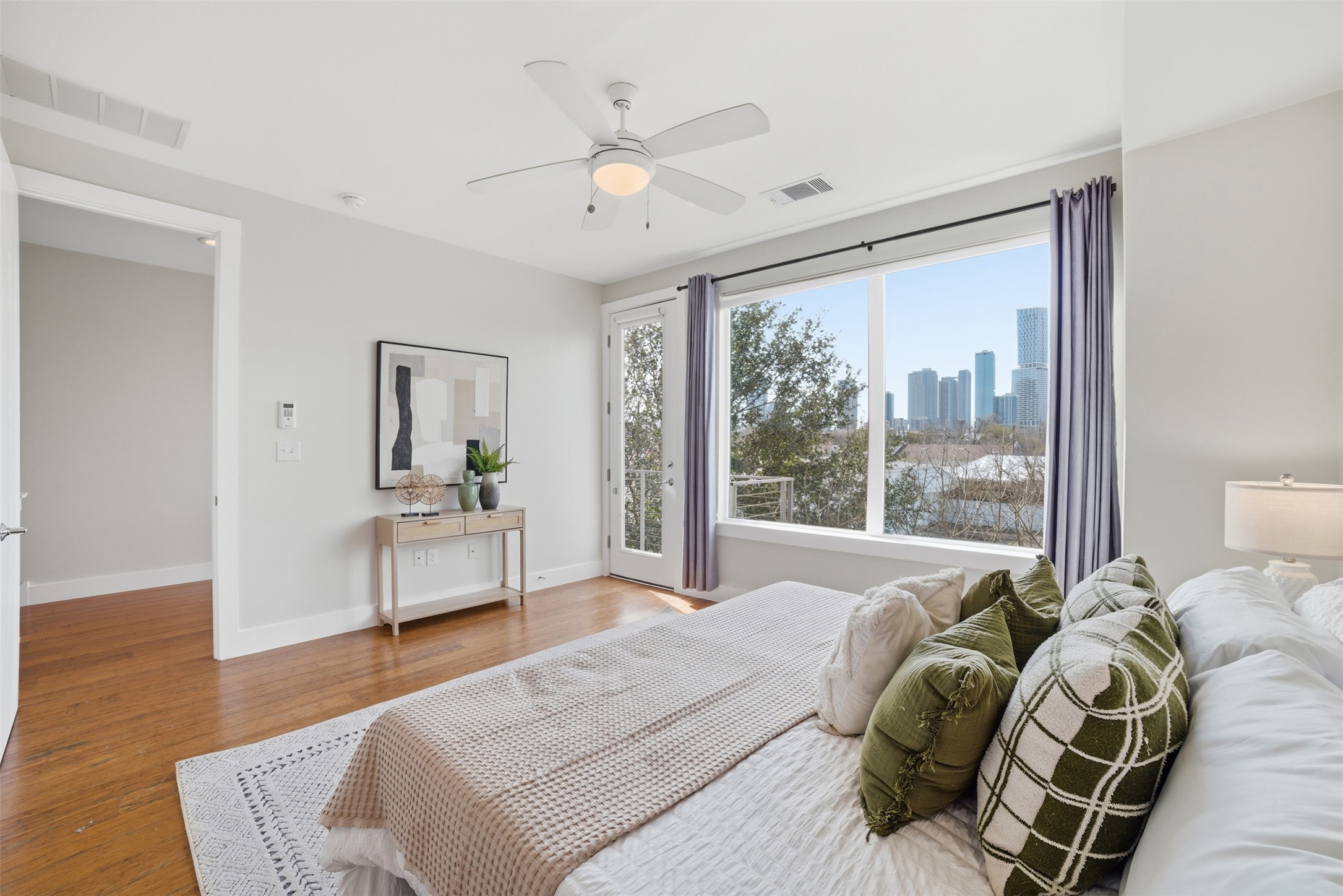 1801 East 2nd Street, Unit 2 Austin, TX 78702 - Photo 1 of 1 a bedroom with a bed and a window