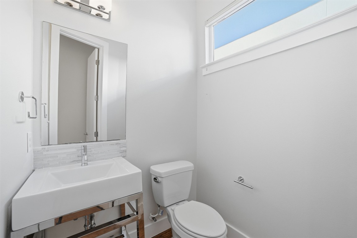1801 East 2nd Street, Unit 2 Austin, TX 78702 - Photo 13 of 34 Half bath located adjacent to the living room.