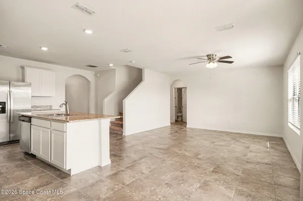 a view of a big room with carpet