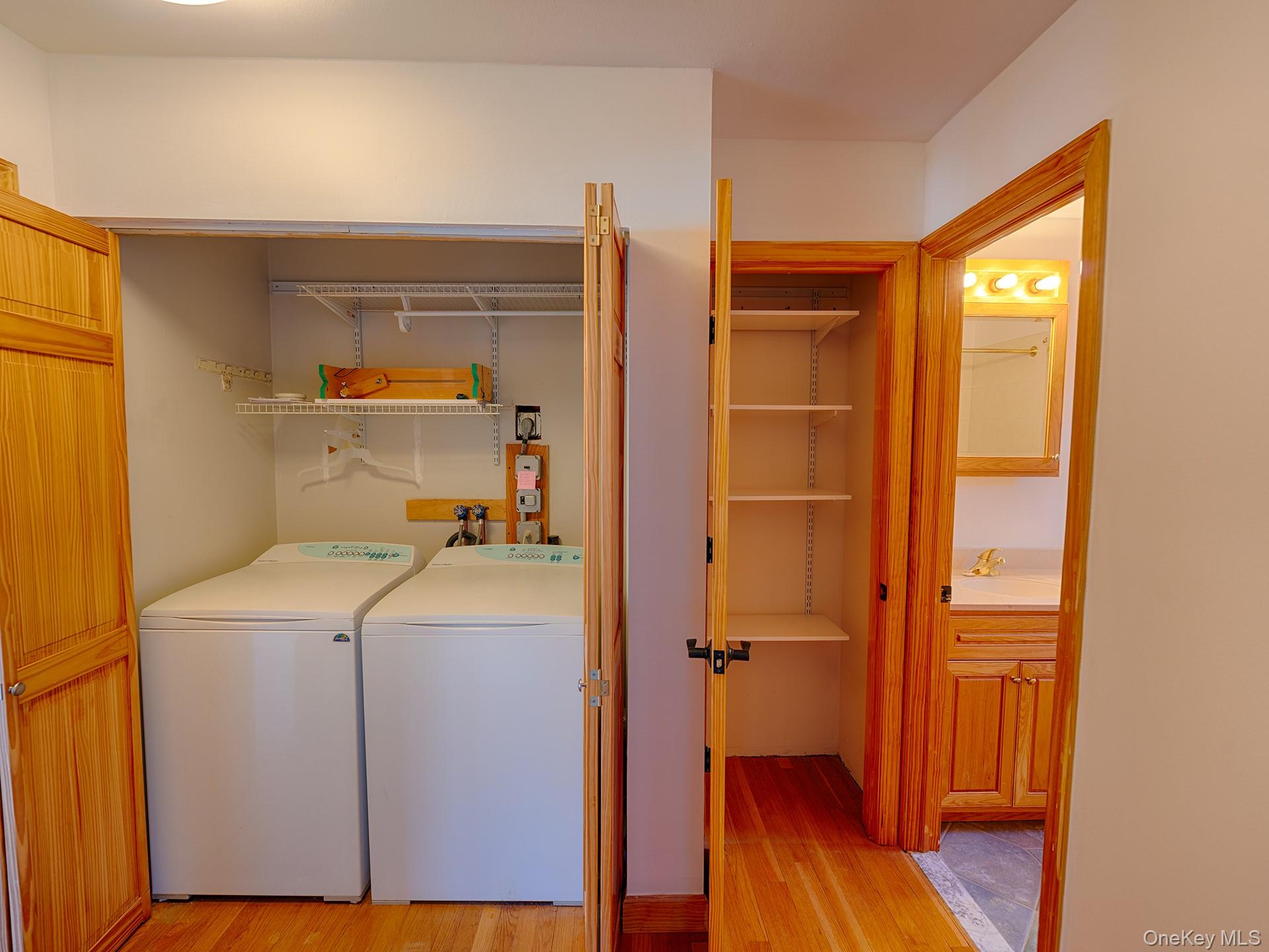 4 Forge Gate Drive, Unit F2B Cold Spring, NY 10516 - Photo 12 of 15 Washroom featuring light wood finished floors and separate washer and dryer
