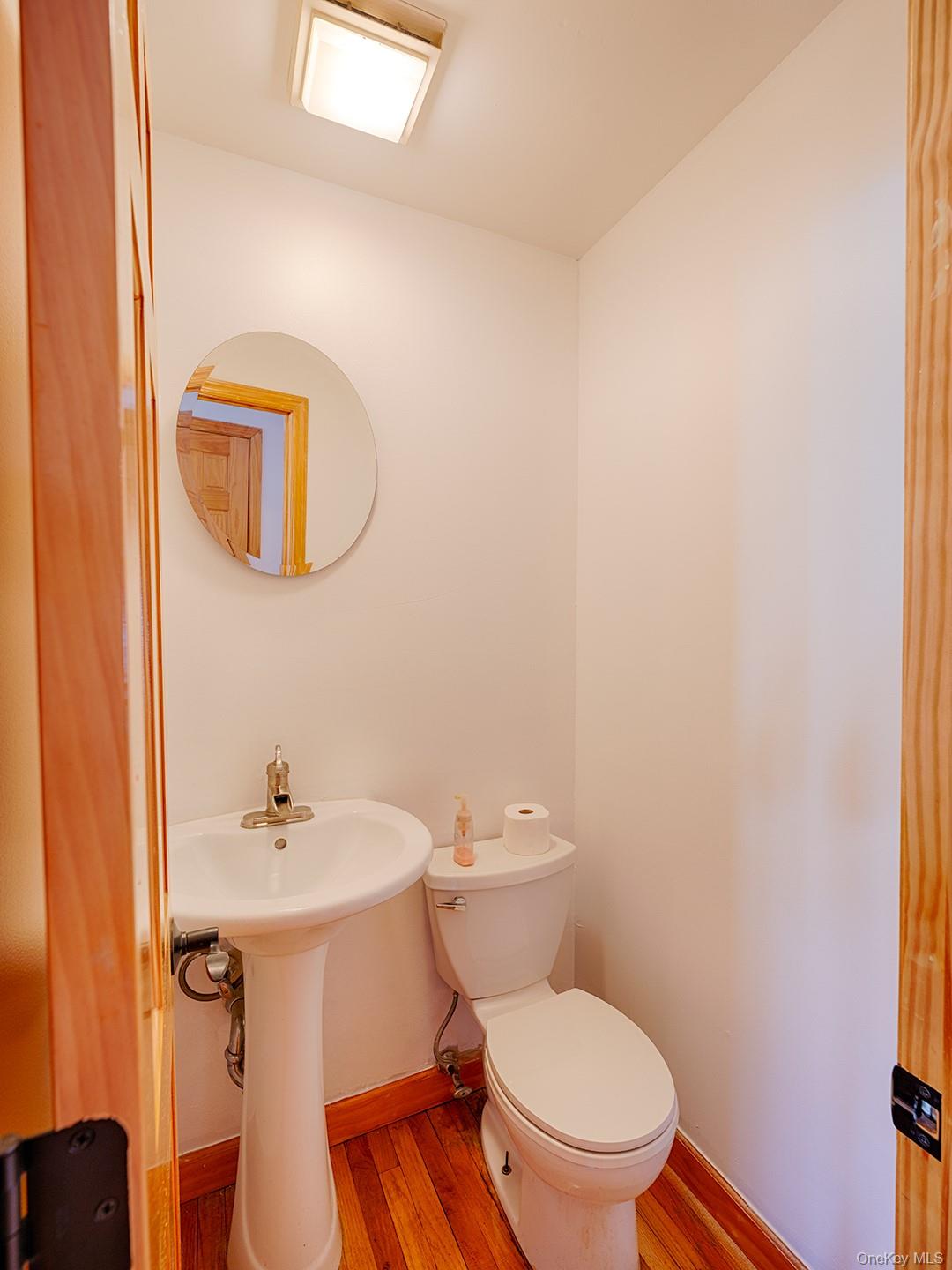 4 Forge Gate Drive, Unit F2B Cold Spring, NY 10516 - Photo 15 of 15 Bathroom featuring wood finished floors and toilet