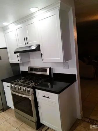 a kitchen with a stove and a sink