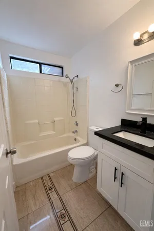 a bathroom with a sink a toilet and a bathtub